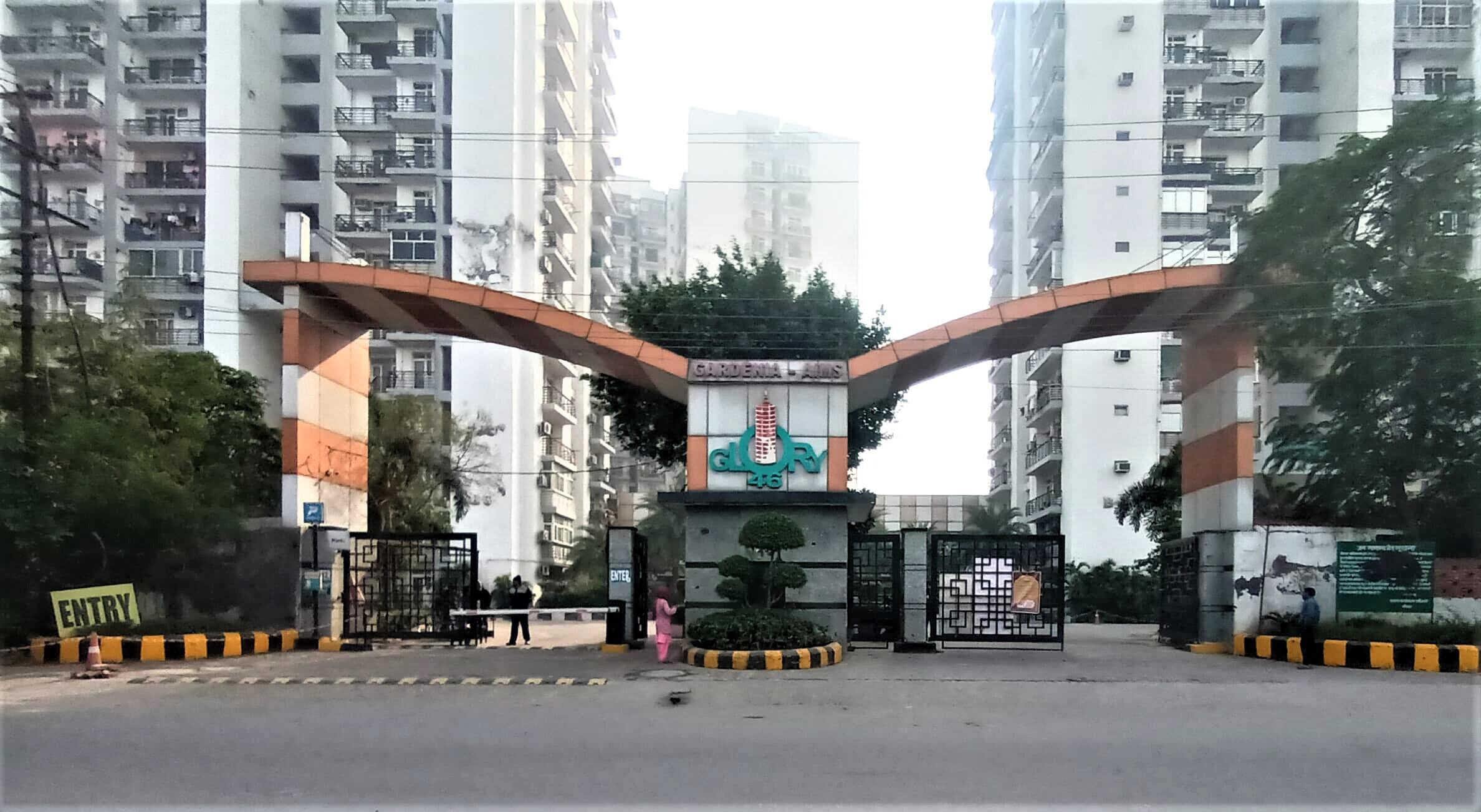 Gardenia Glory Sector 46 Noida society clubhouse building and landscaped surroundings