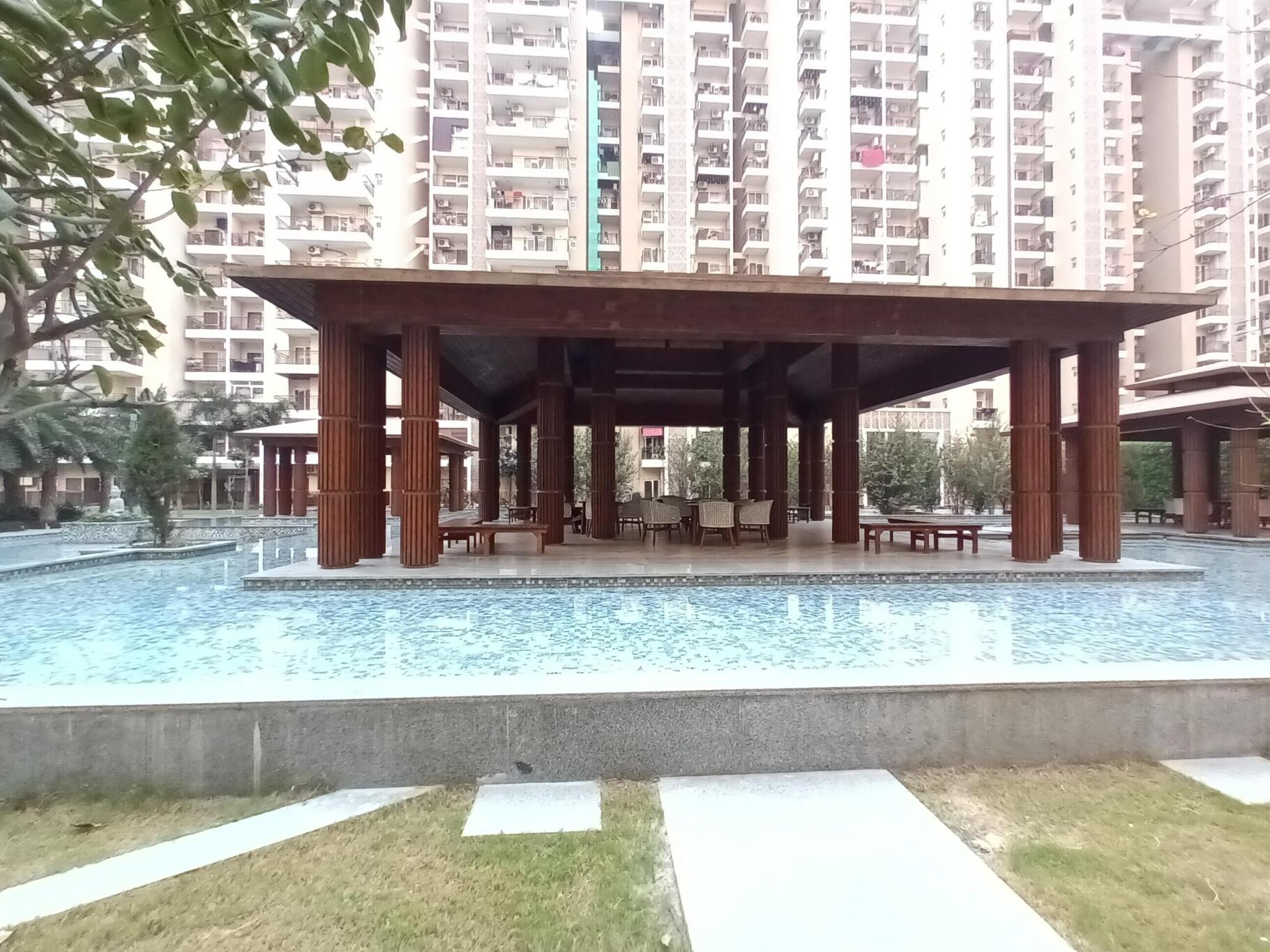 Ace Divino luxury clubhouse and swimming pool amenity block